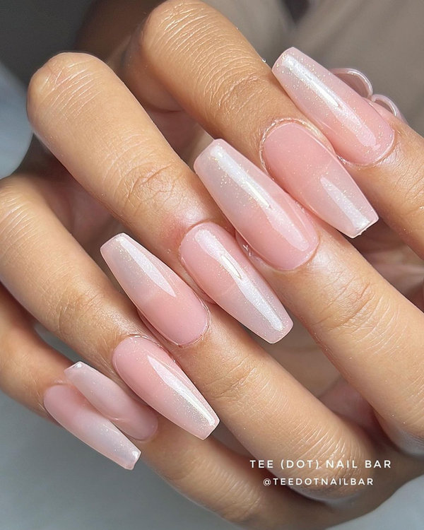 Light blush pink nails matching a rose-tinted wedding gown