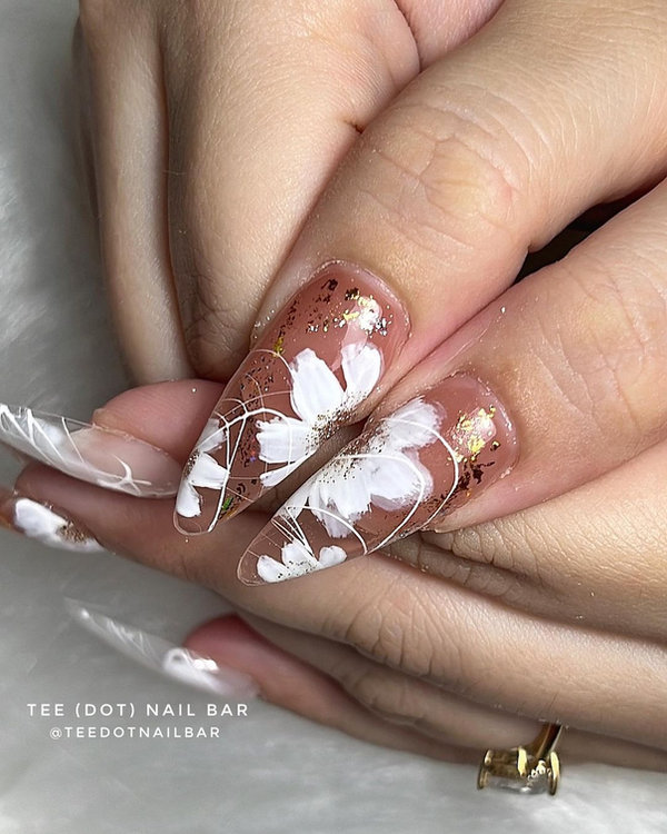 Floral theme nail art with nude tones